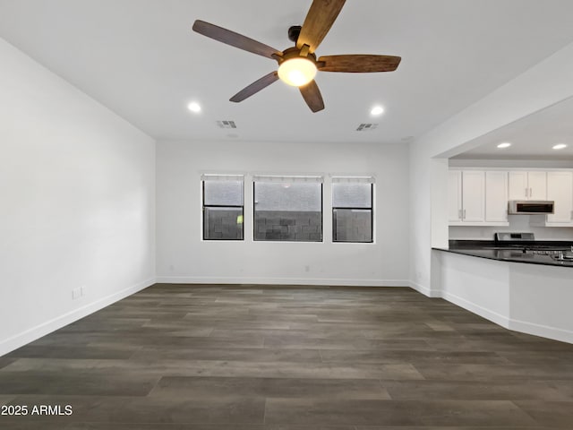 interior space featuring dark hardwood / wood-style flooring and ceiling fan