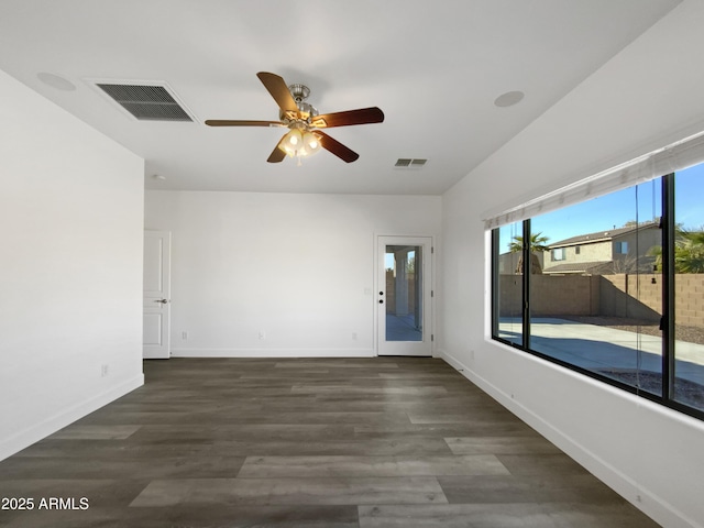 unfurnished room with ceiling fan and dark hardwood / wood-style flooring