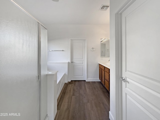 bathroom featuring vanity, shower with separate bathtub, and hardwood / wood-style flooring