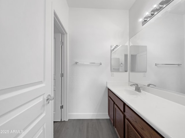 bathroom with vanity and hardwood / wood-style flooring