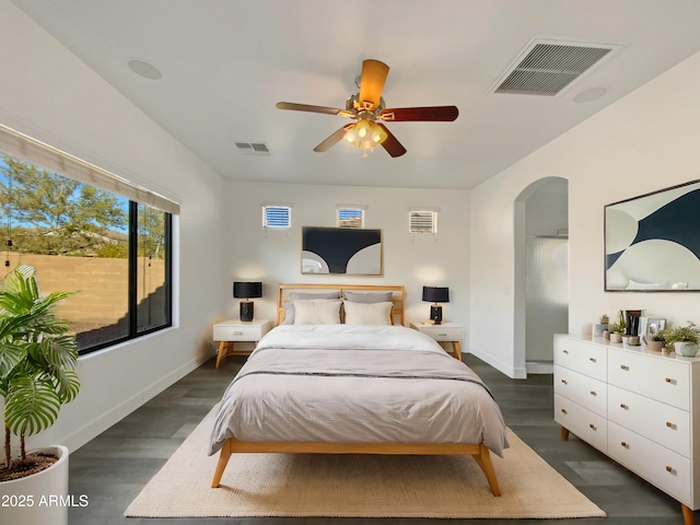 bedroom with ceiling fan and dark wood-type flooring