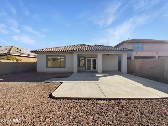 back of property featuring a patio area