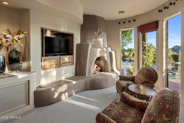 living area with carpet flooring and recessed lighting