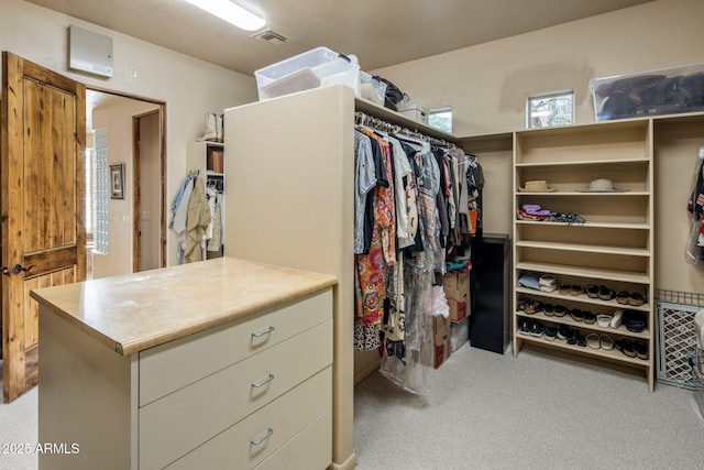 walk in closet featuring carpet