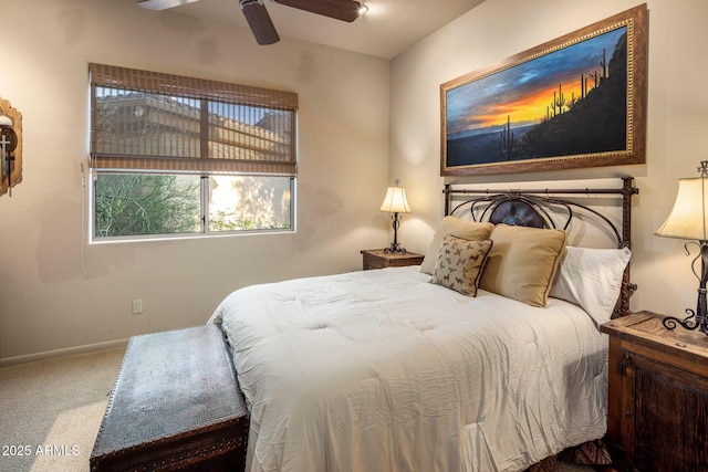 bedroom with carpet flooring, a ceiling fan, and baseboards