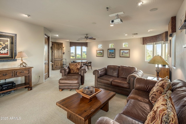 living area with light carpet, ceiling fan, and recessed lighting