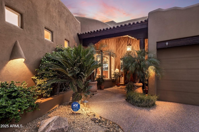 view of patio terrace at dusk