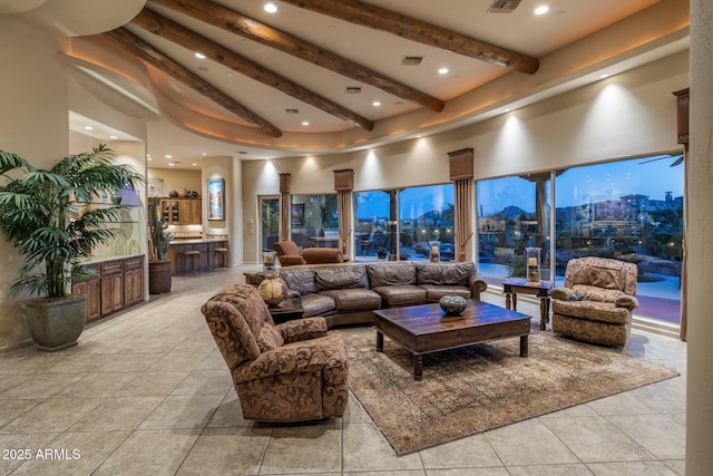 lobby featuring beam ceiling, a towering ceiling, and recessed lighting