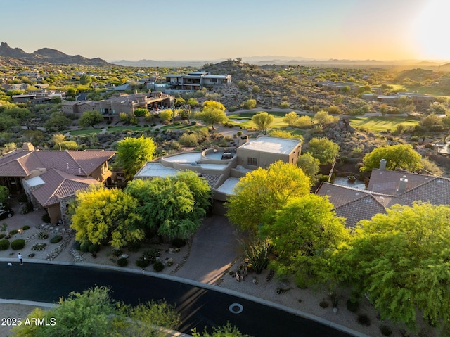 aerial view at dusk of a residential view and a mountain view