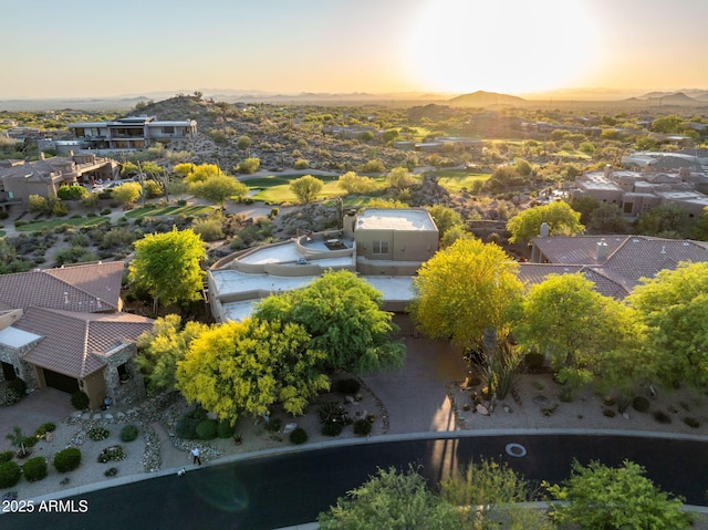aerial view at dusk of a residential view and a mountain view