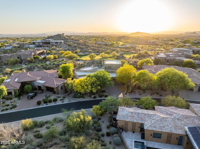 aerial view at dusk of a residential view and a mountain view