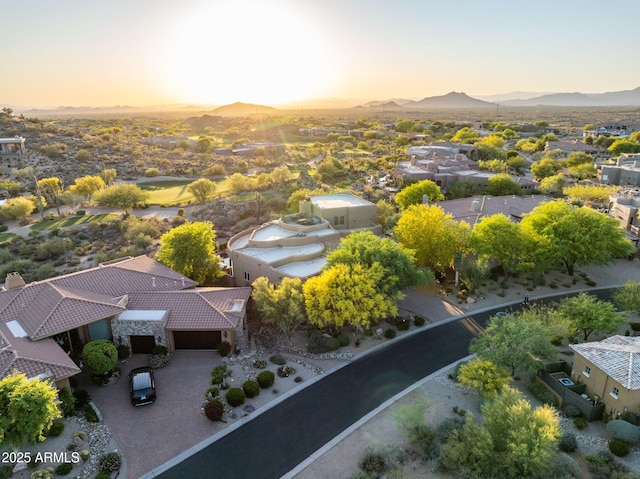 aerial view of residential area featuring a mountain backdrop