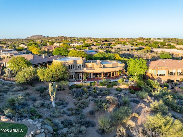 aerial view of residential area featuring a mountain backdrop