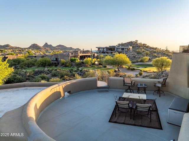 patio terrace at dusk with a mountain view