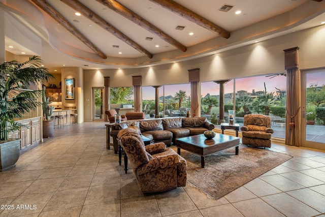 lobby featuring beamed ceiling, a towering ceiling, and recessed lighting