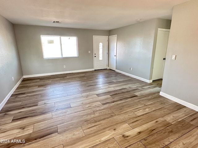 entryway with light hardwood / wood-style floors