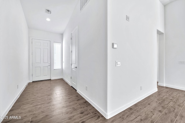 entryway with hardwood / wood-style floors