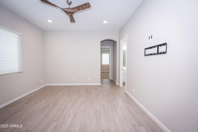 spare room with ceiling fan and light hardwood / wood-style flooring