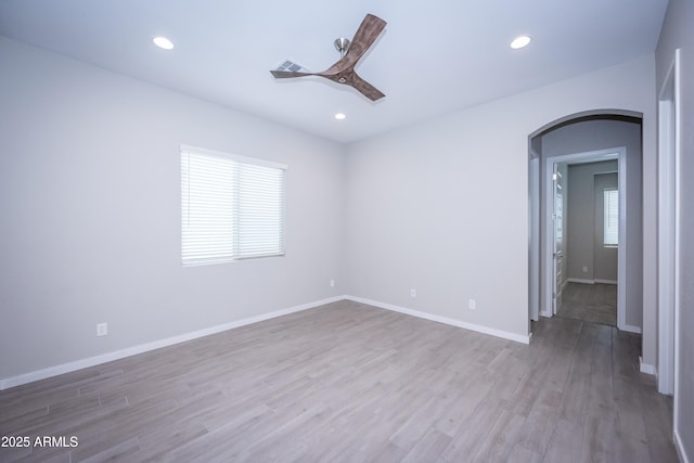 empty room with light hardwood / wood-style flooring