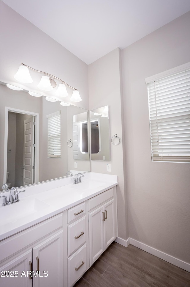 bathroom featuring vanity and hardwood / wood-style flooring