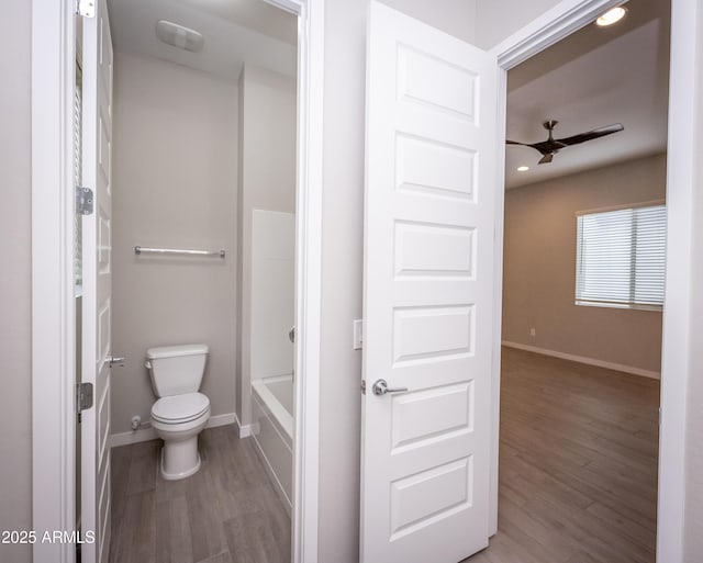 bathroom with ceiling fan, wood-type flooring, and toilet