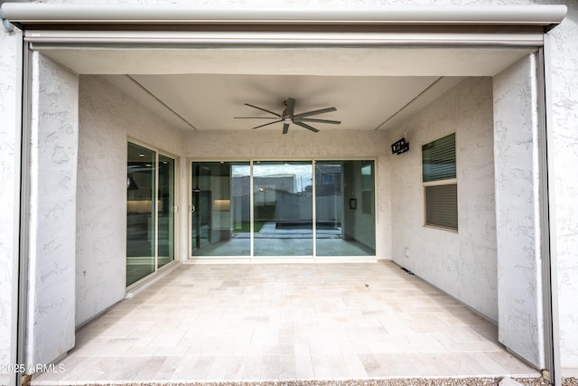 view of patio featuring ceiling fan