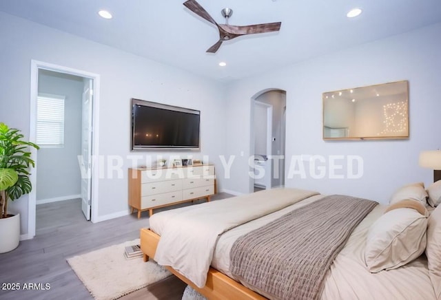 bedroom with ceiling fan and wood-type flooring