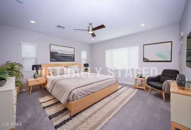 bedroom featuring multiple windows and ceiling fan