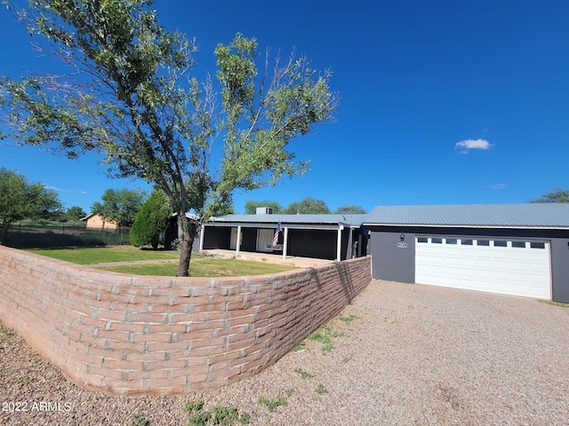 view of front of home featuring an outbuilding