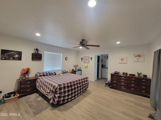 bedroom with ceiling fan and light hardwood / wood-style floors