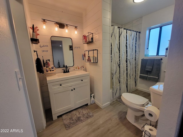 bathroom with vanity, hardwood / wood-style floors, and toilet