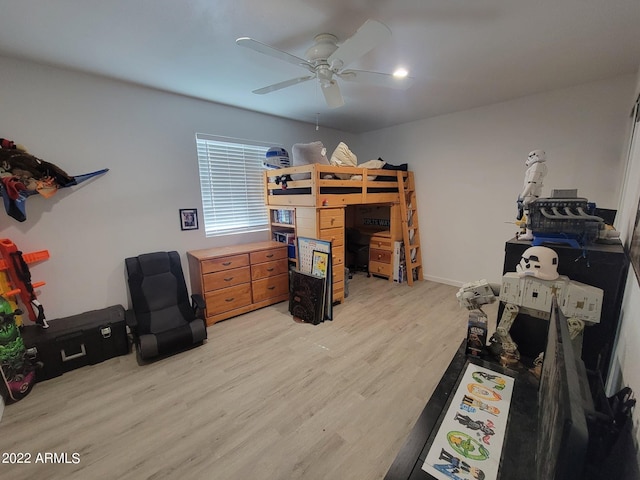 home office featuring ceiling fan and light hardwood / wood-style floors