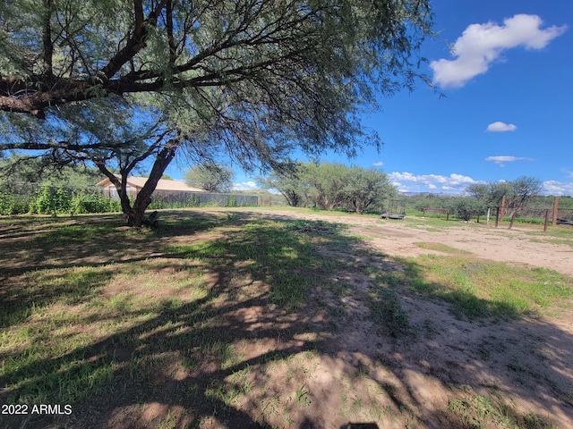 view of yard with a rural view