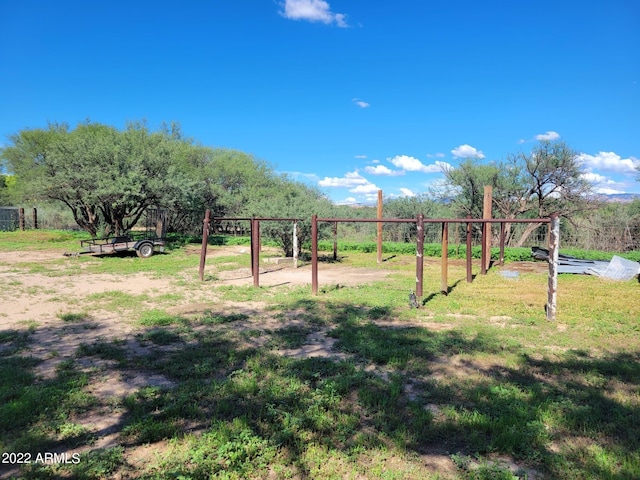 view of jungle gym with a lawn