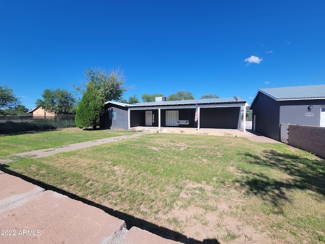 view of front of home with a patio area and a front lawn