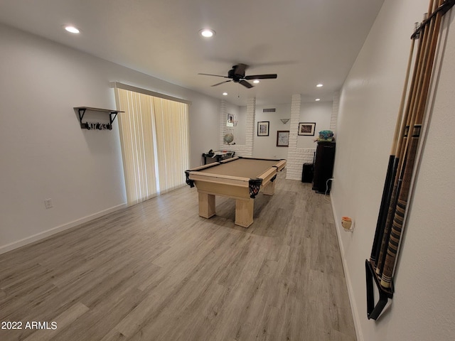 game room with ceiling fan, brick wall, pool table, and light hardwood / wood-style floors