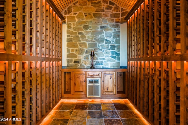 wine cellar featuring vaulted ceiling