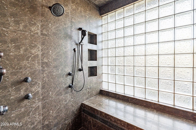 bathroom featuring tiled shower