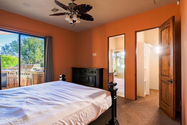 carpeted bedroom featuring ensuite bathroom and access to outside