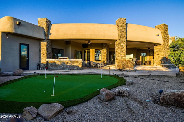 back of property with a patio and ceiling fan