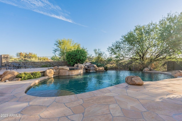 view of pool featuring a patio and pool water feature