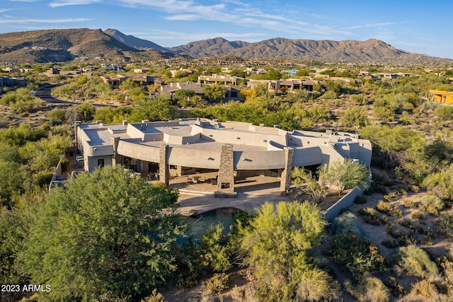 birds eye view of property featuring a mountain view