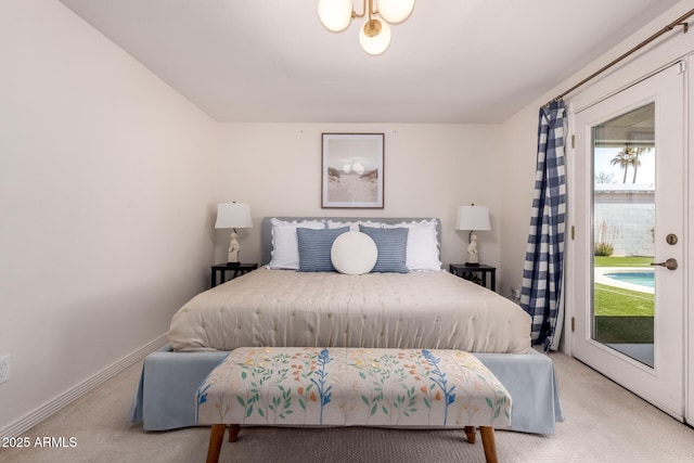 bedroom featuring baseboards, access to exterior, and light colored carpet