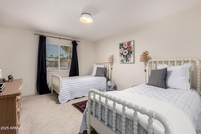 carpeted bedroom featuring baseboards