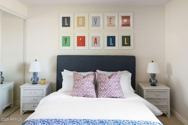 carpeted bedroom with radiator heating unit and baseboards