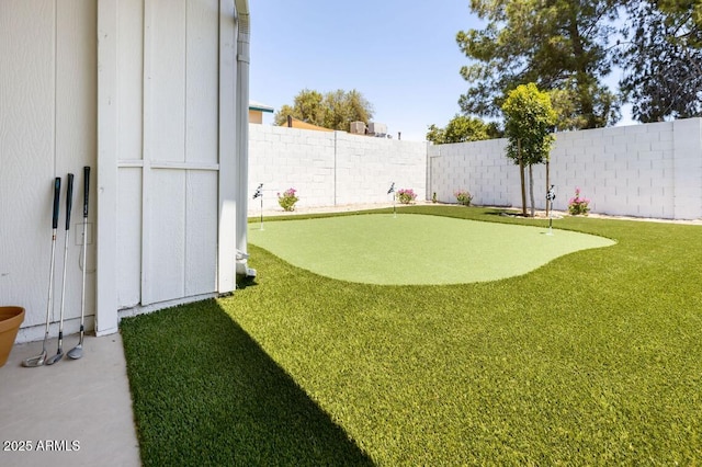 view of yard with a fenced backyard