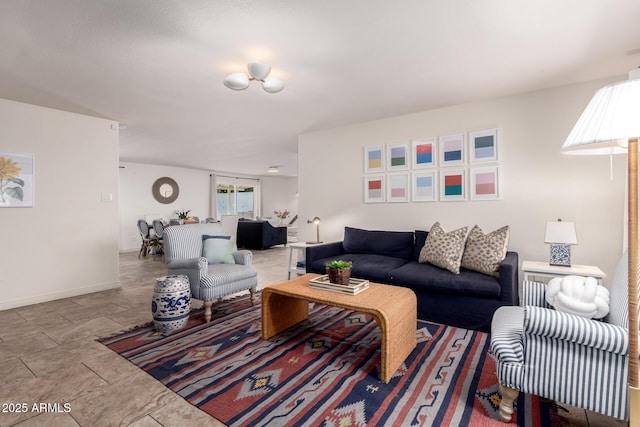 living room featuring baseboards and a wealth of natural light