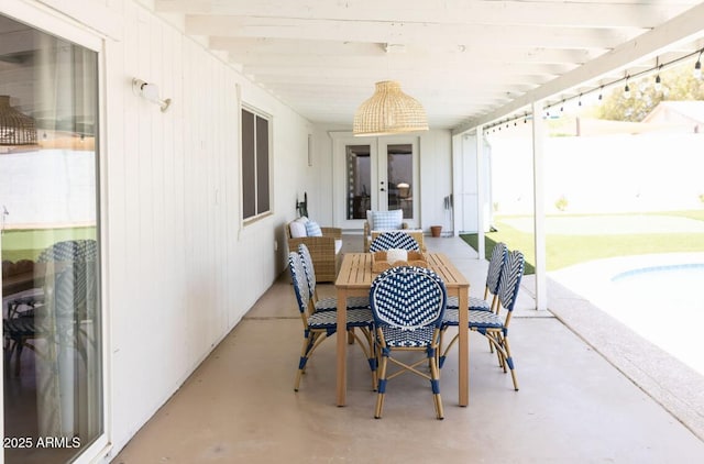 view of patio featuring french doors and fence