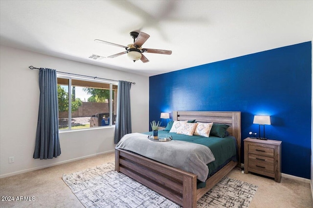 bedroom with baseboards, ceiling fan, visible vents, and carpet