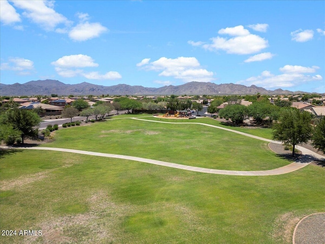 view of community featuring a mountain view and a yard